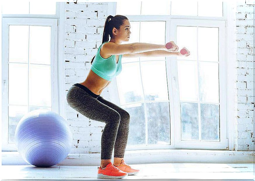 Woman doing squats.