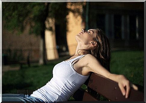 Relaxed woman sunbathing