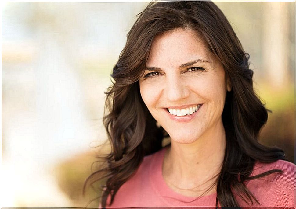 smiling woman thinking about how to grow old