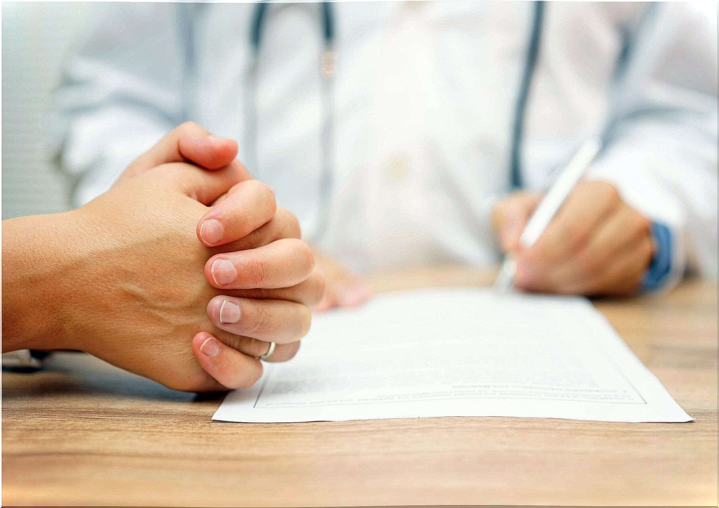 Doctor talking to his patient about treatment.