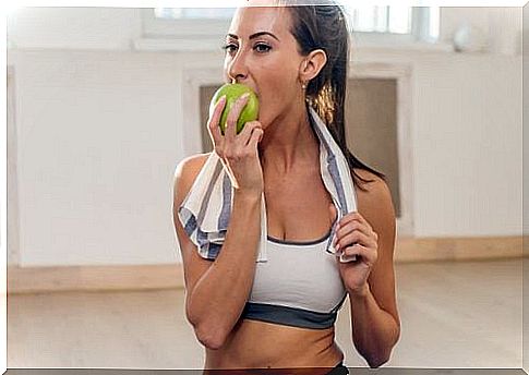 Woman eating an apple