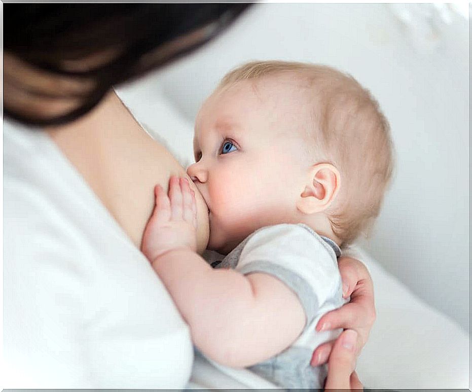 woman breastfeeding baby