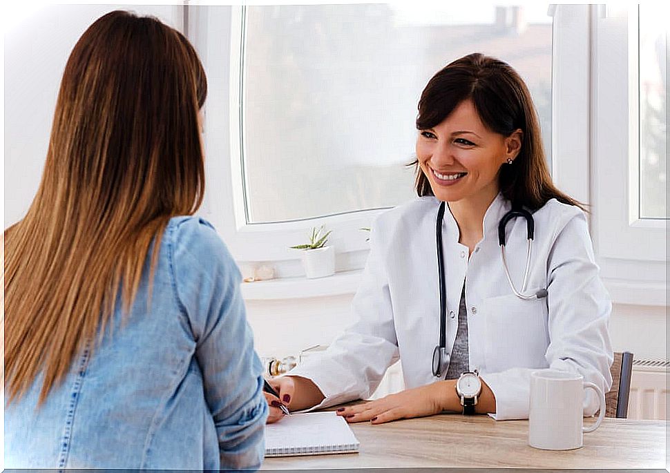 Woman in consultation talking to a doctor