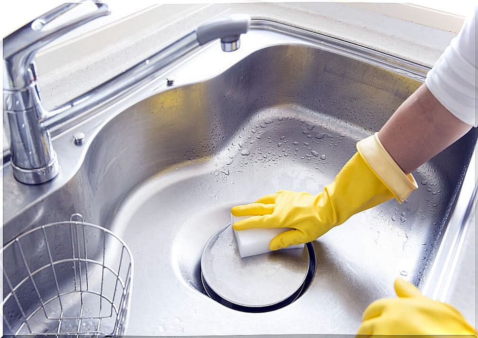 Cleaning a dishwasher.