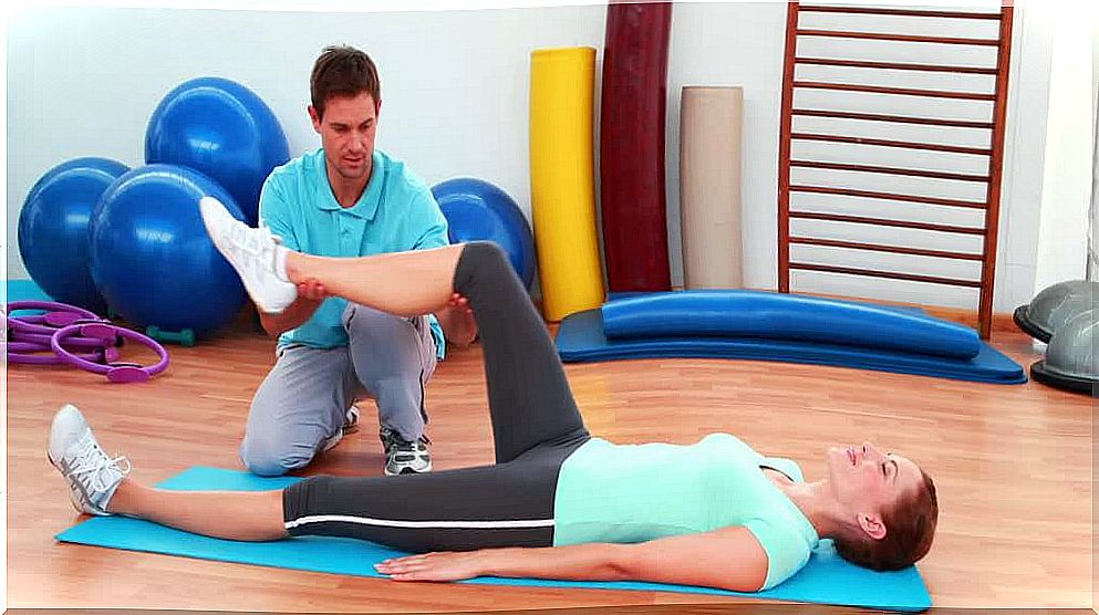 Physiotherapist doing exercises with a patient