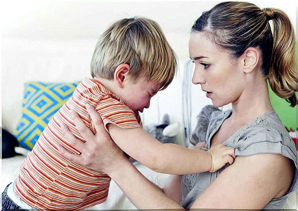 Boy with a tantrum and mother sets limits.